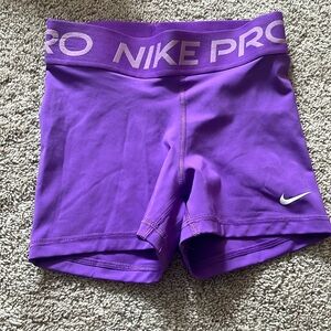 Purple nike pros size XS